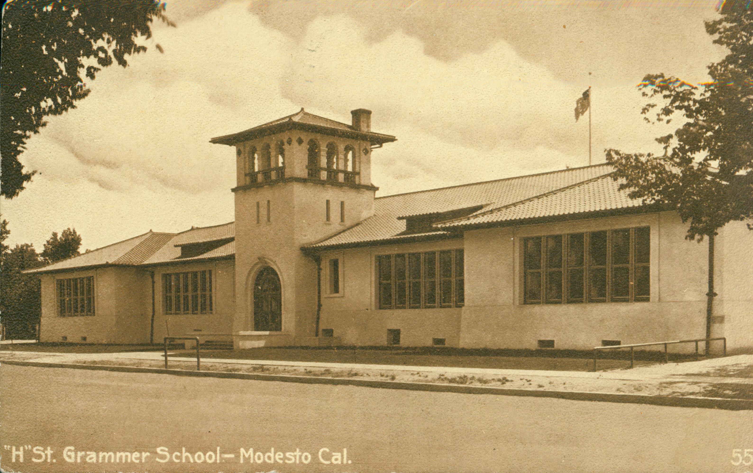 Shows a frontal view of 'H' St. Grammar School in Modesto